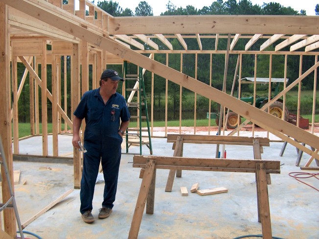 A builder at a property construction site